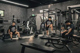 A group of men sitting in a gym