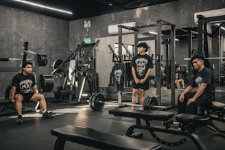 A group of people sitting in a gym