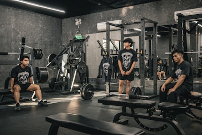 A group of people sitting in a gym