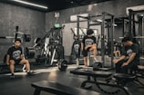 A group of people sitting in a gym