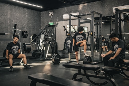 A group of people sitting in a gym
