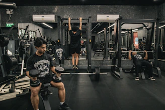 A man doing squats in a gym