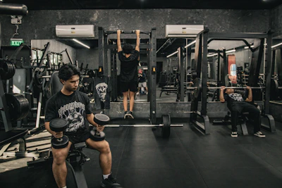 A man doing squats in a gym