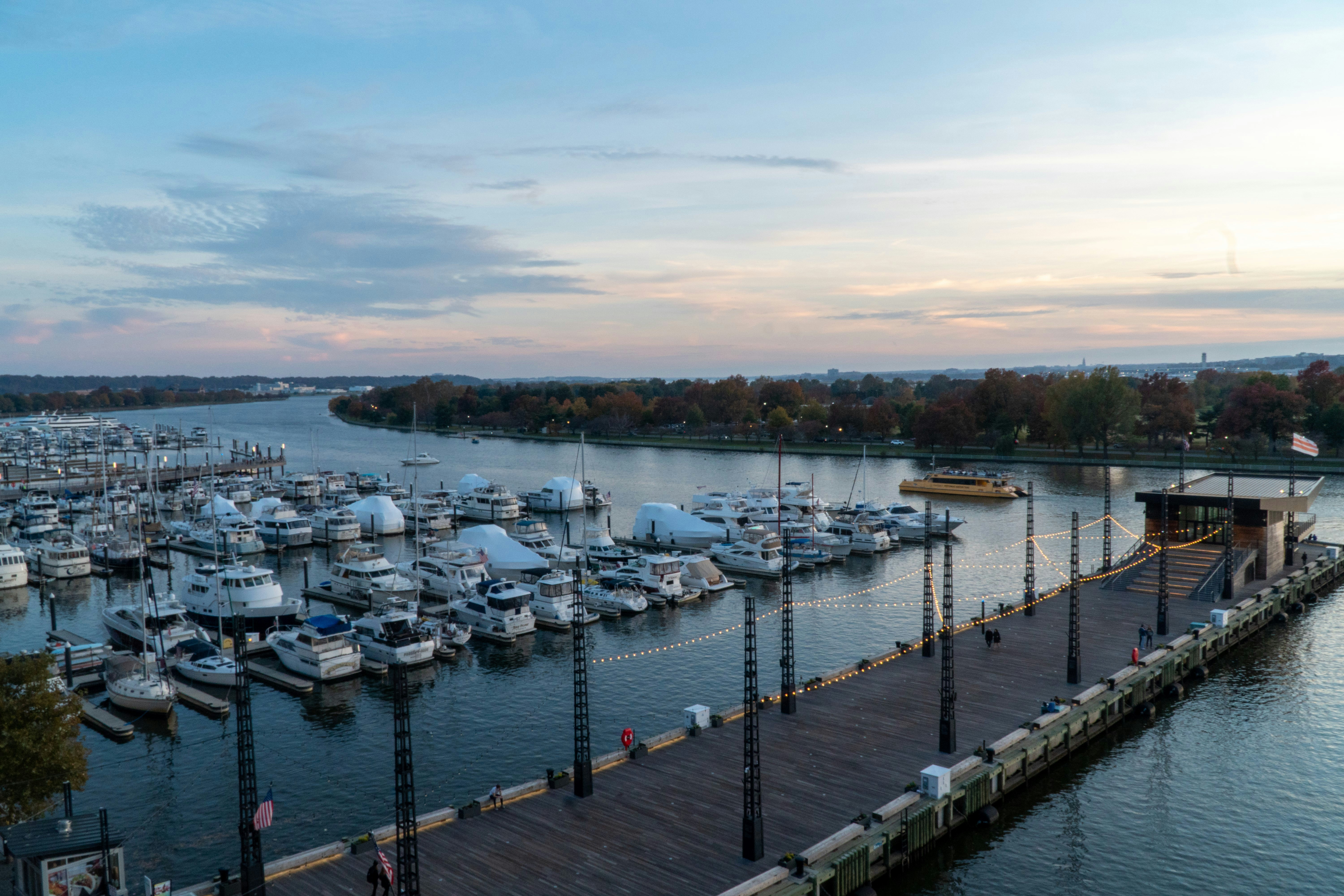 A harbor filled with lots of boats under a cloudy sky