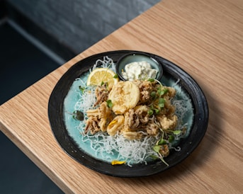 A plate of food on a wooden table