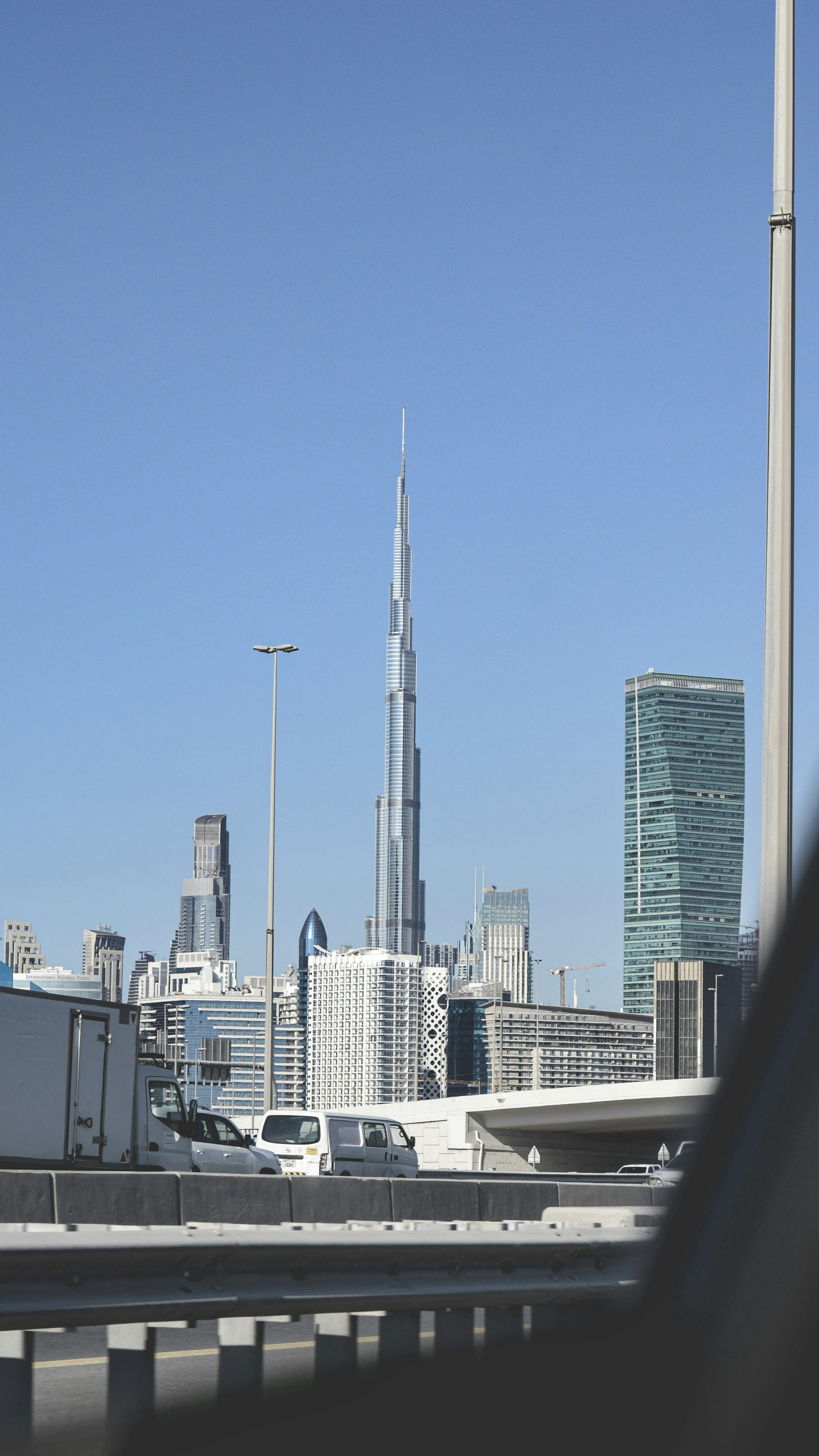 A view of a city skyline from a bridge