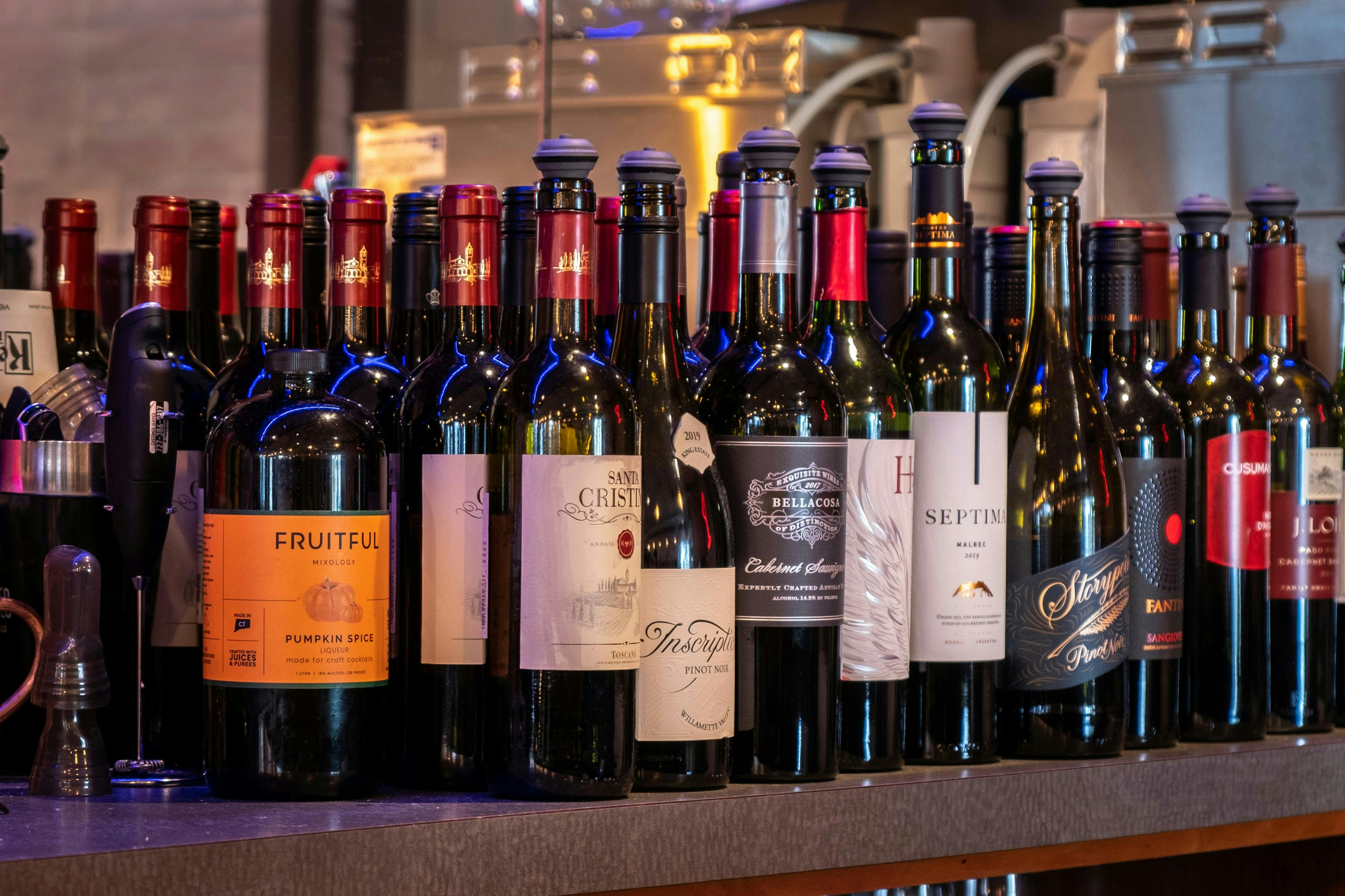 Assorted Wine Bottles on Display at a Bar