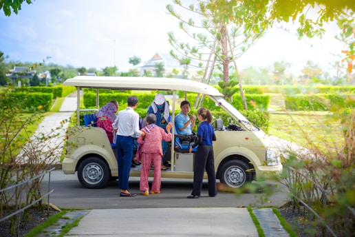 A group of people standing in front of a van