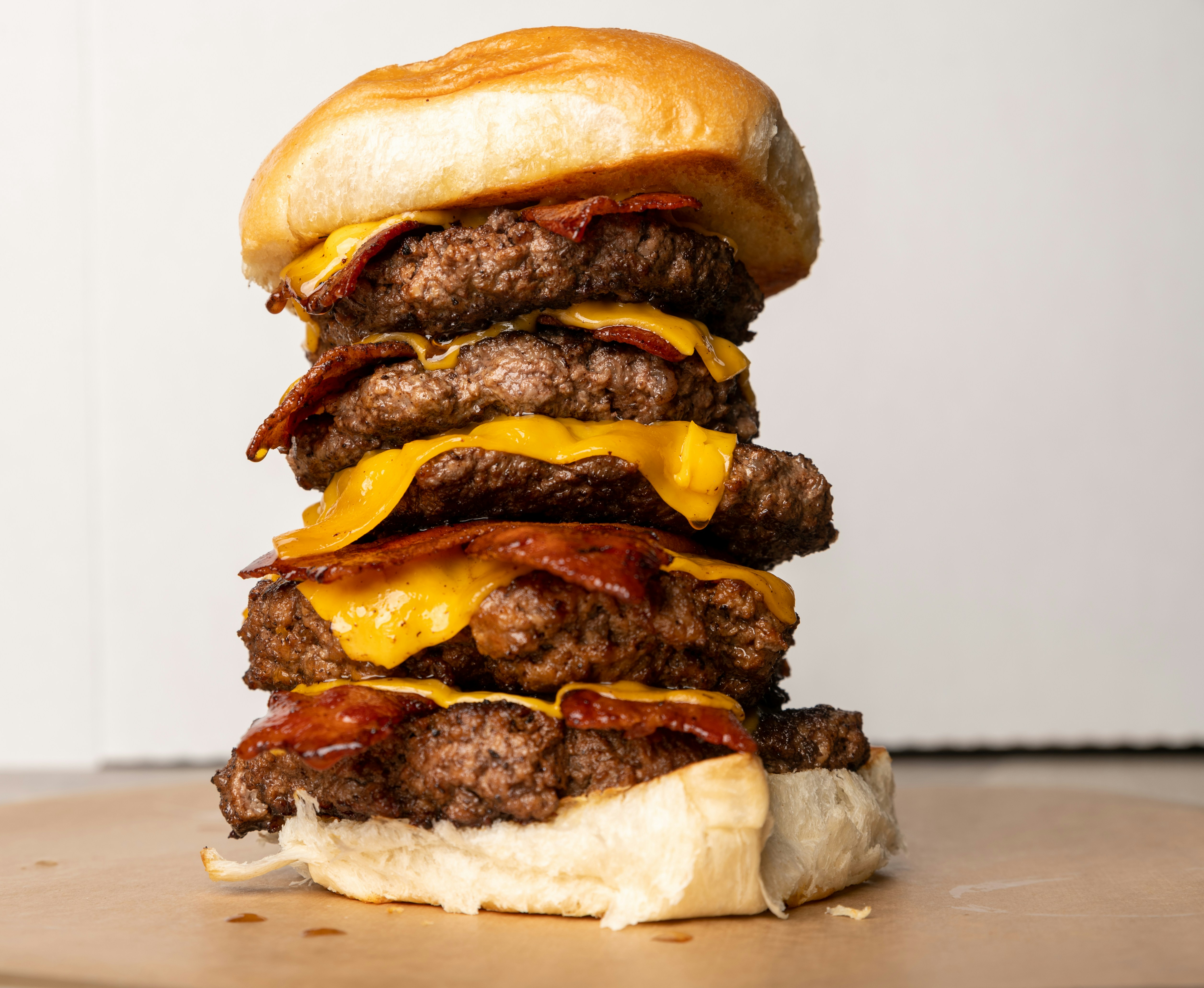 A cheeseburger is stacked on top of each other