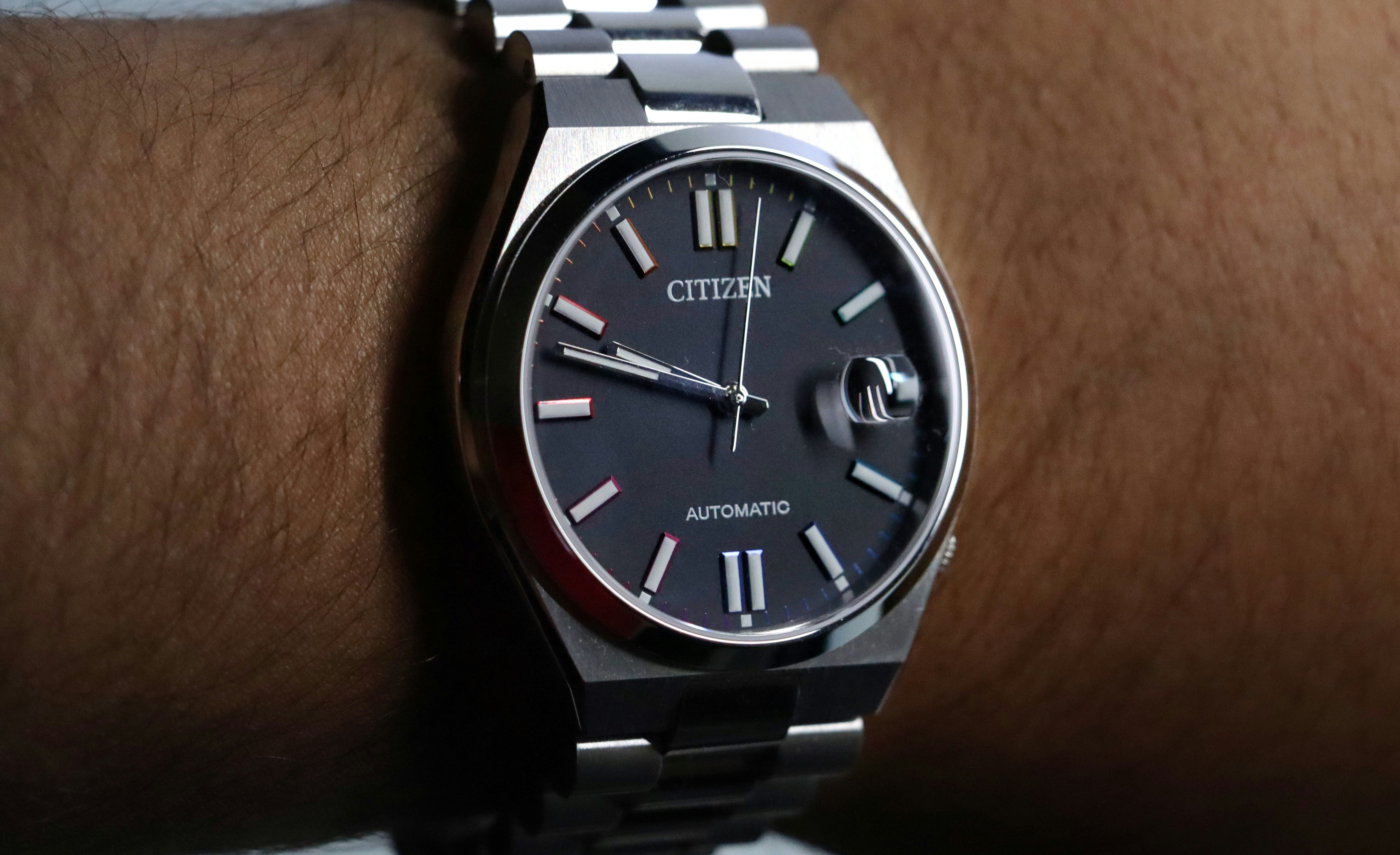 A close up of a wrist with a watch on it