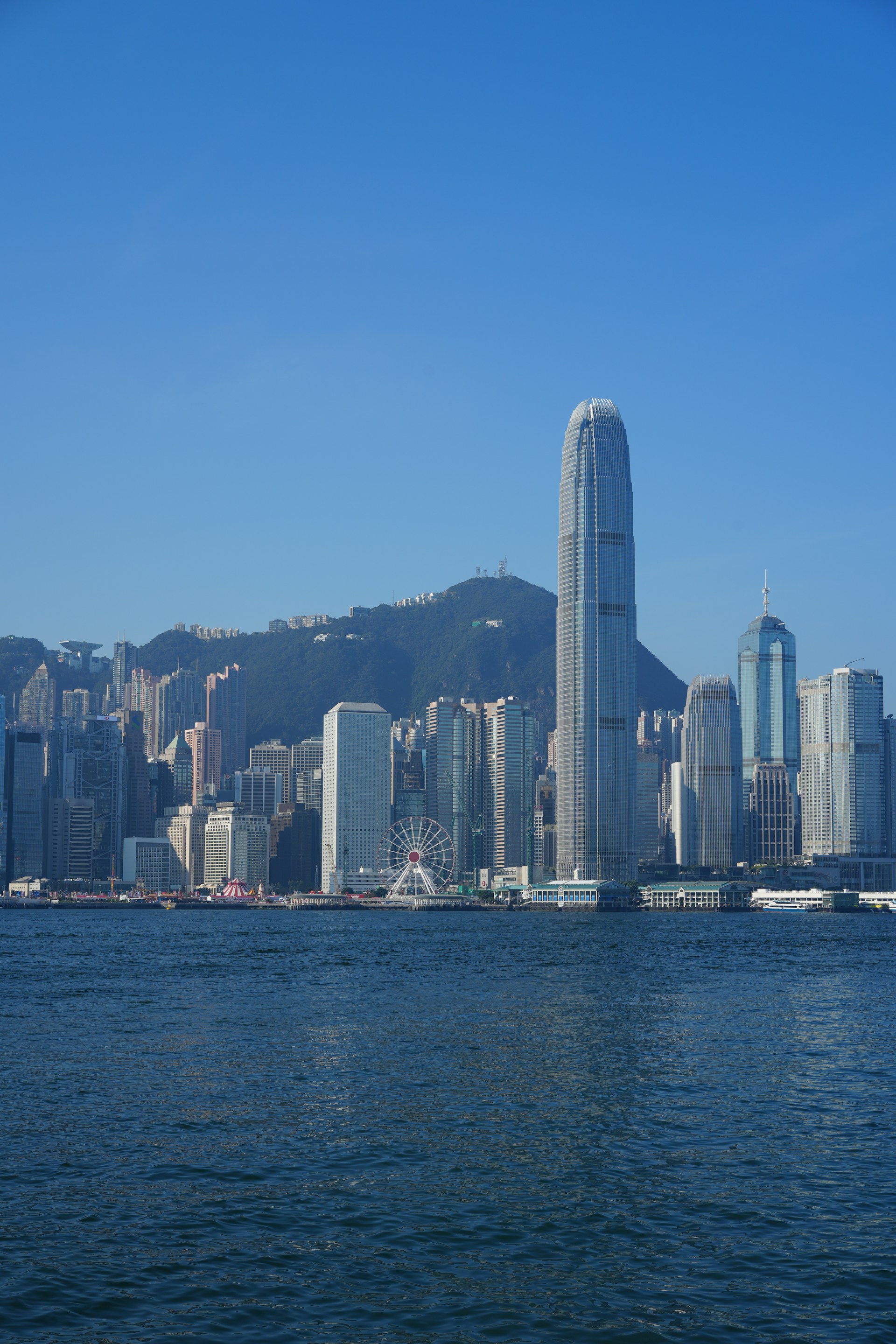 A large body of water with a city in the background