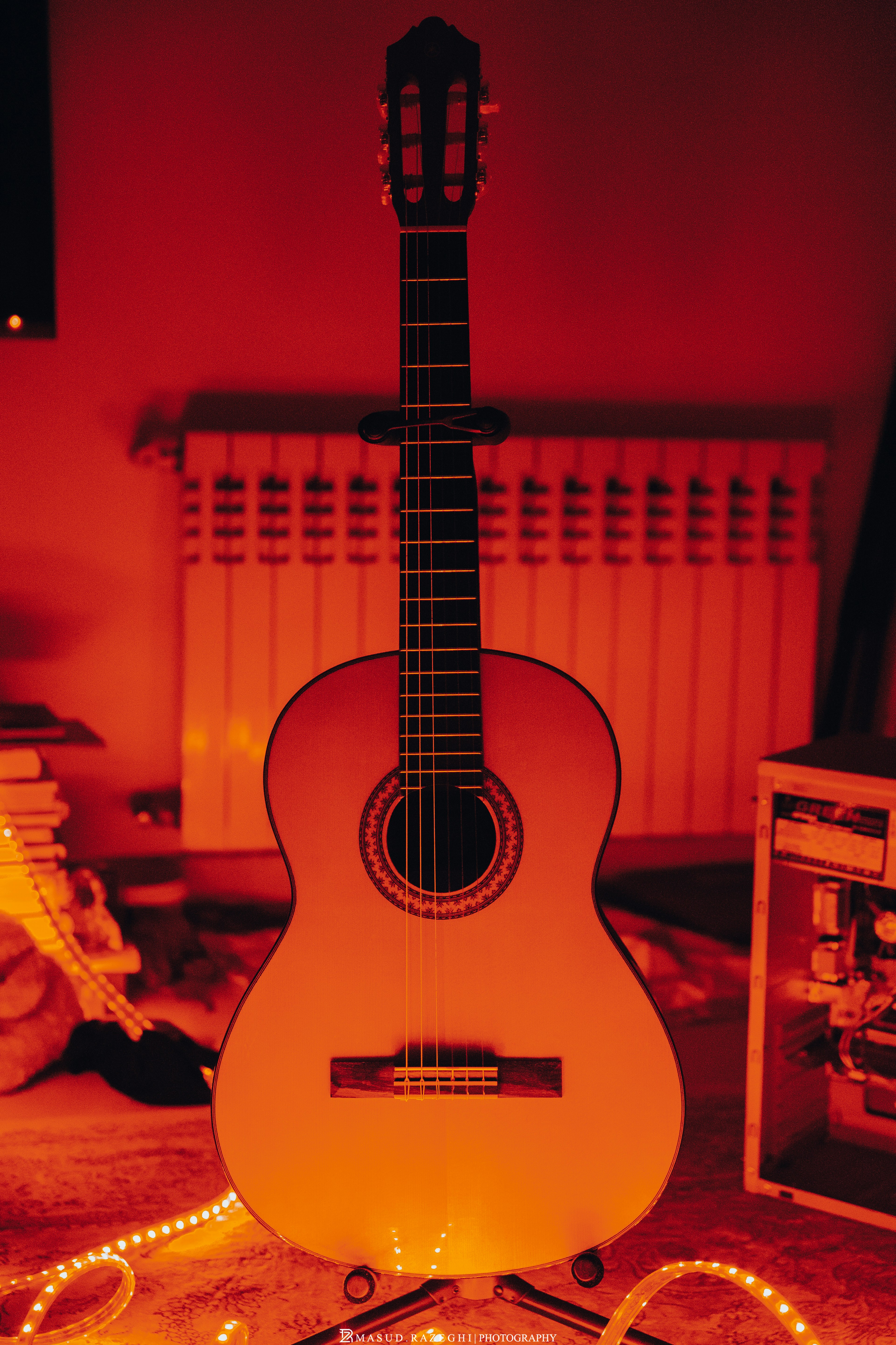 A white guitar sitting on top of a table