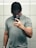 A man taking a selfie in a bathroom mirror