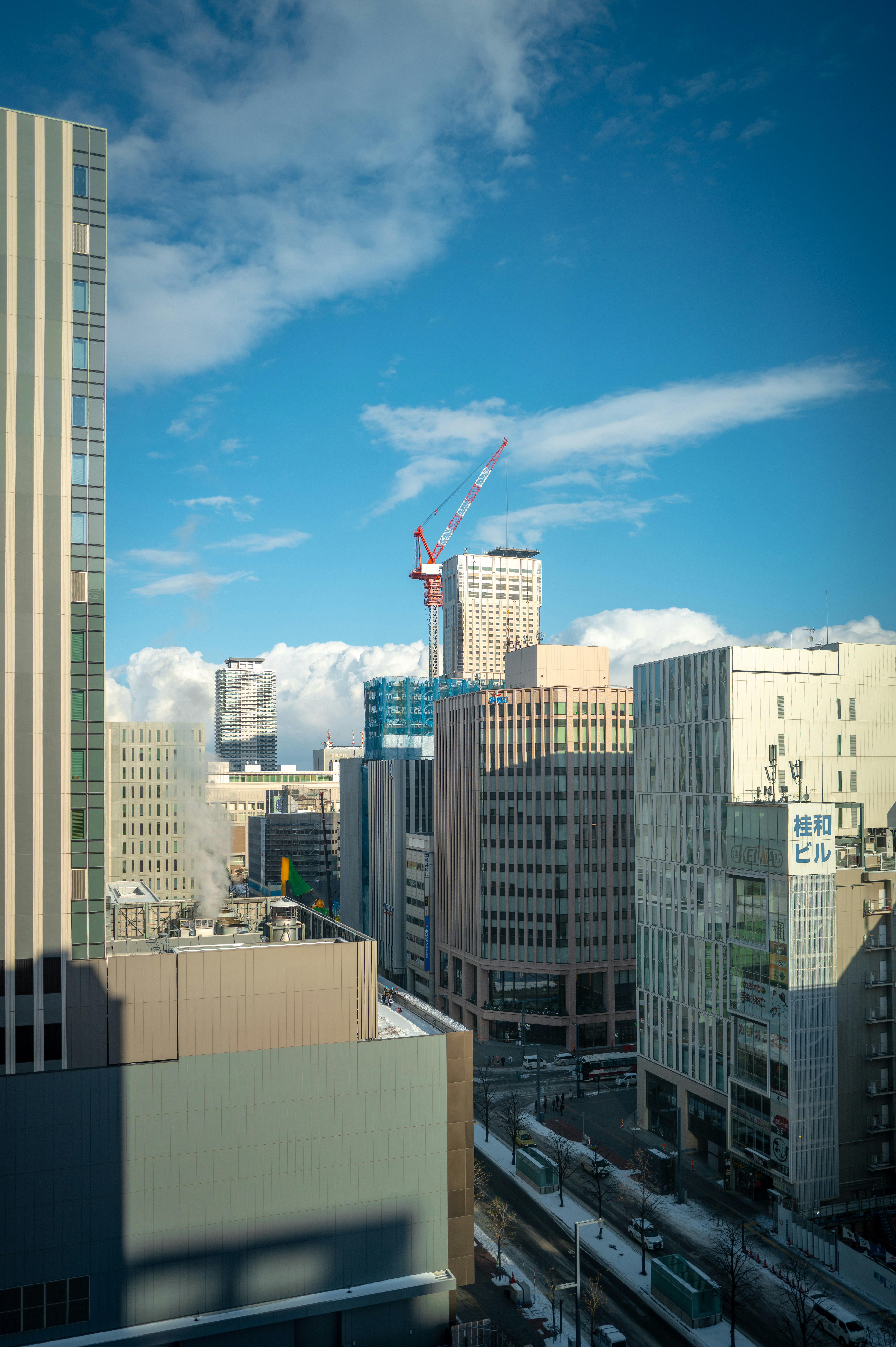 A view of a city from a high rise building photo – Free Car Image on ...