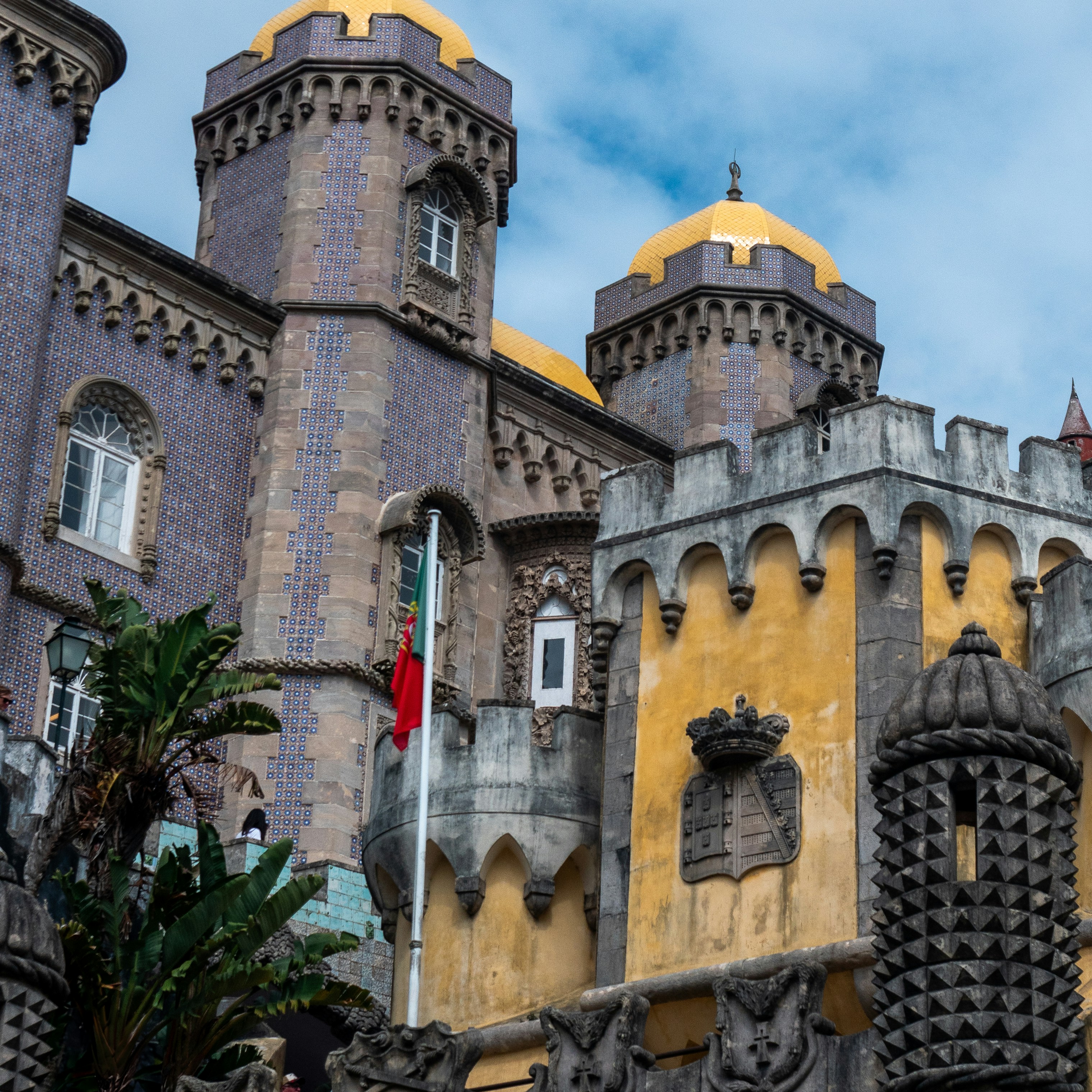 A large castle like building with a clock on it's side