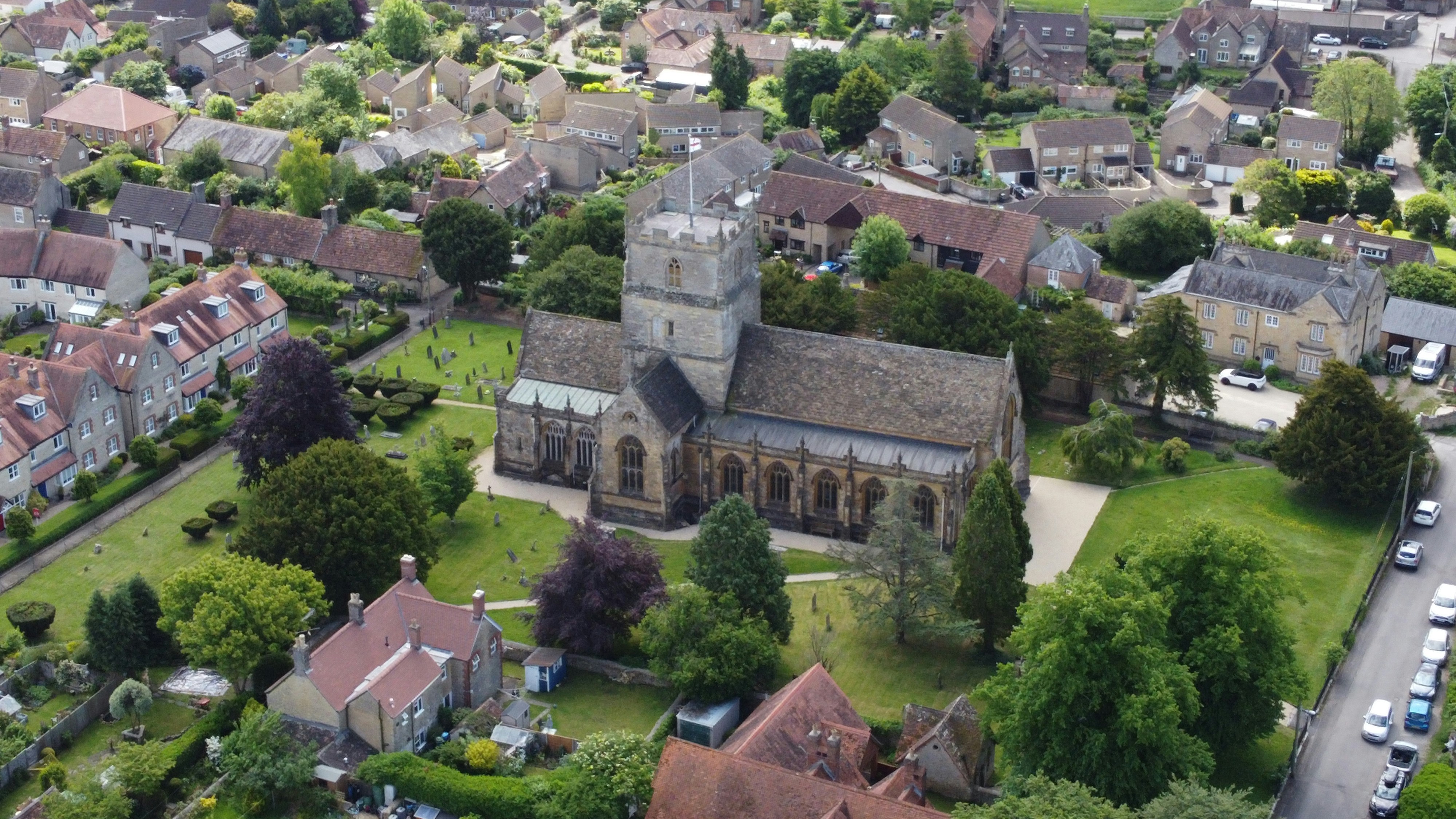 An aerial view of a small town with a church