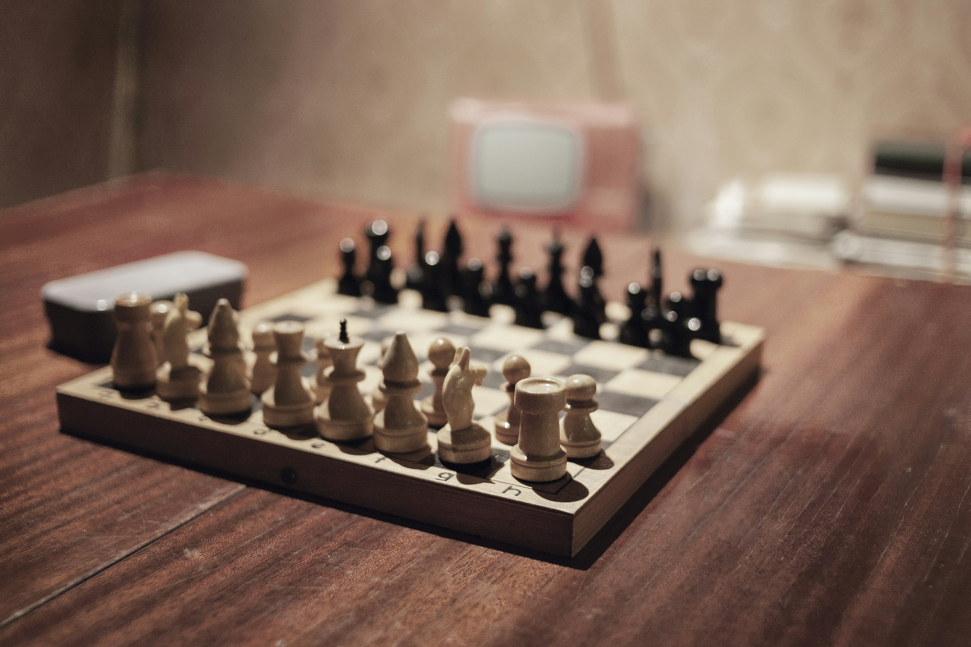 A chess board with a chess set on it