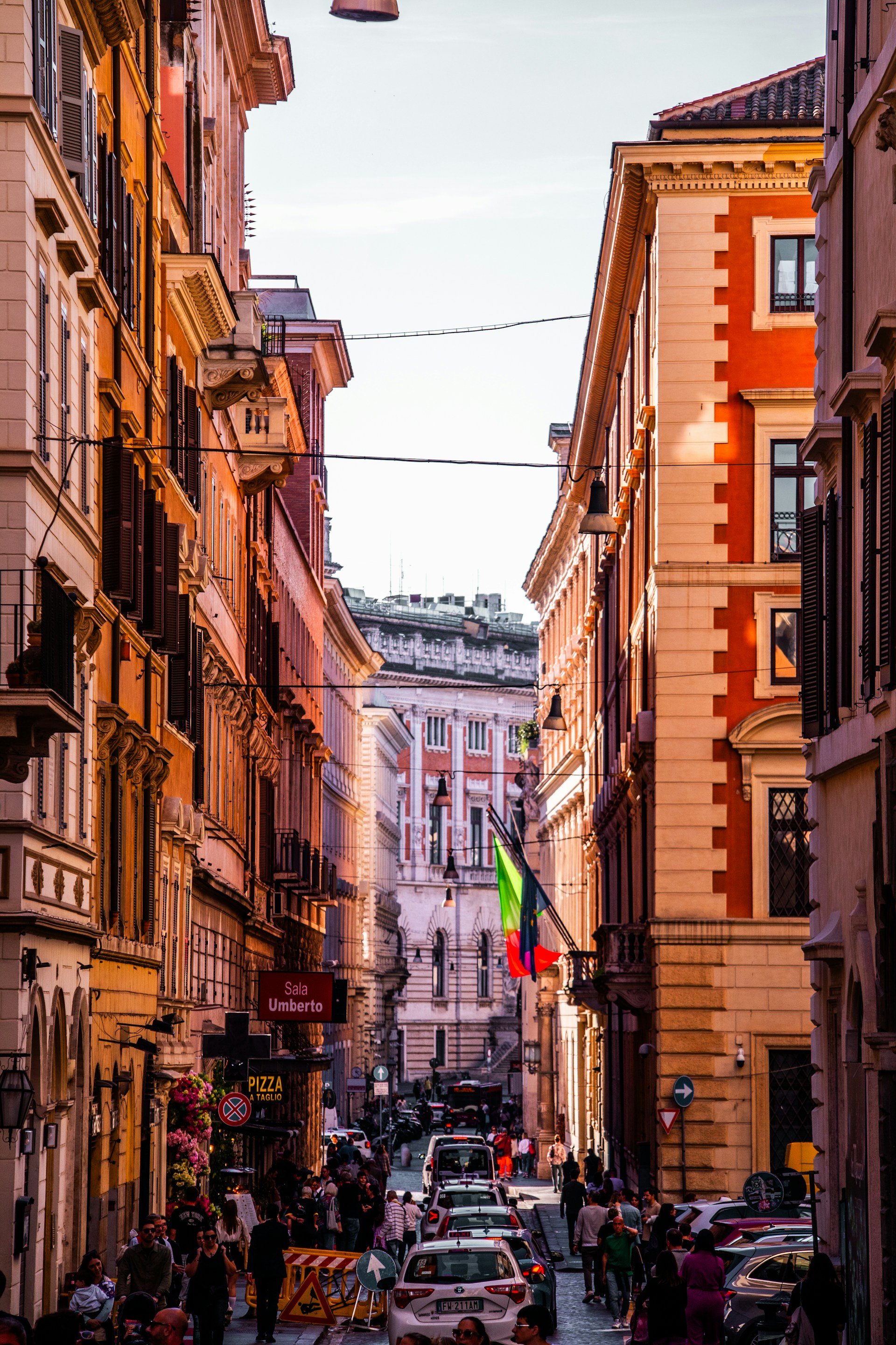 A narrow city street lined with tall buildings