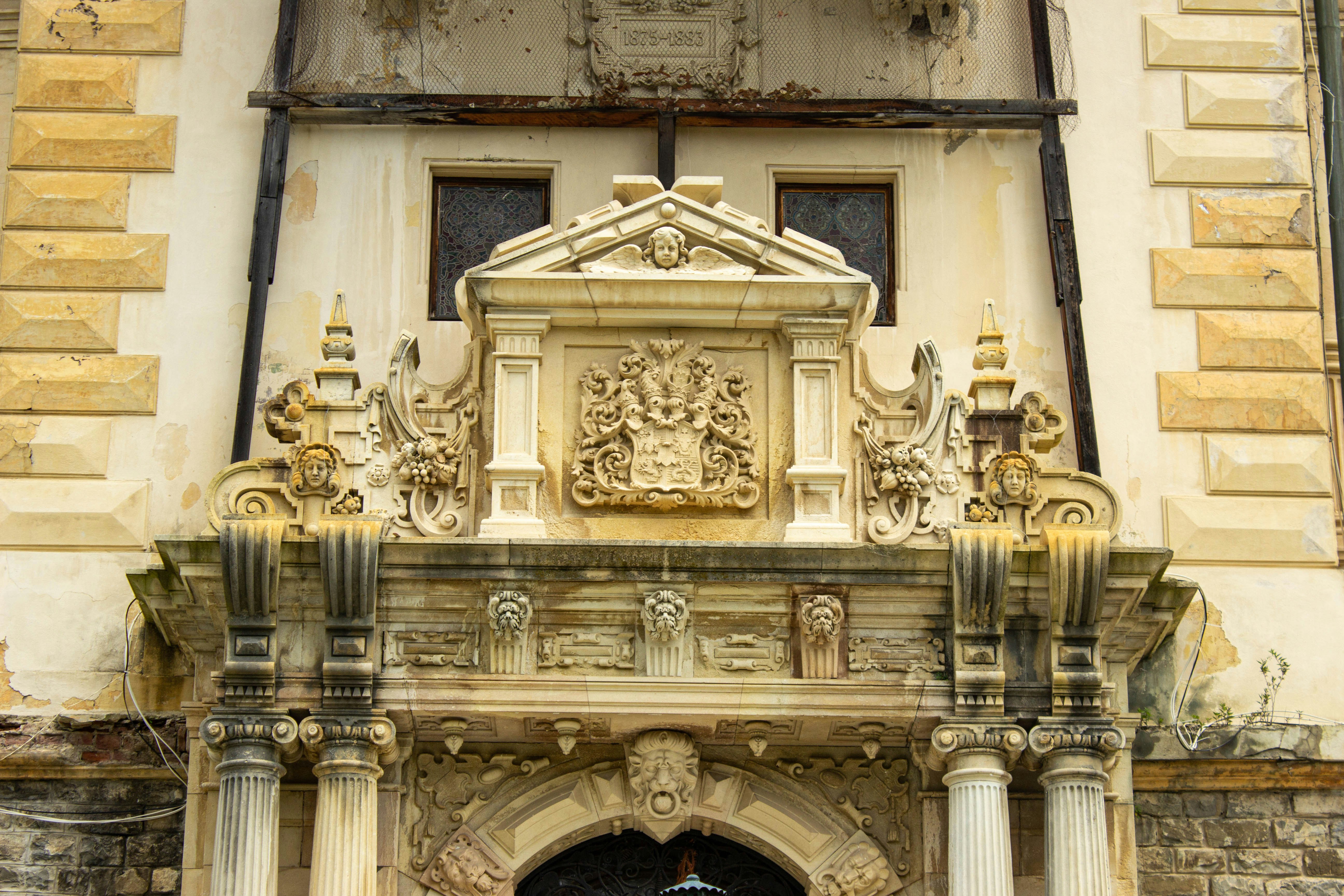 Georgian architecture hotel facade, cream stone, warm afternoon sun, formal garden