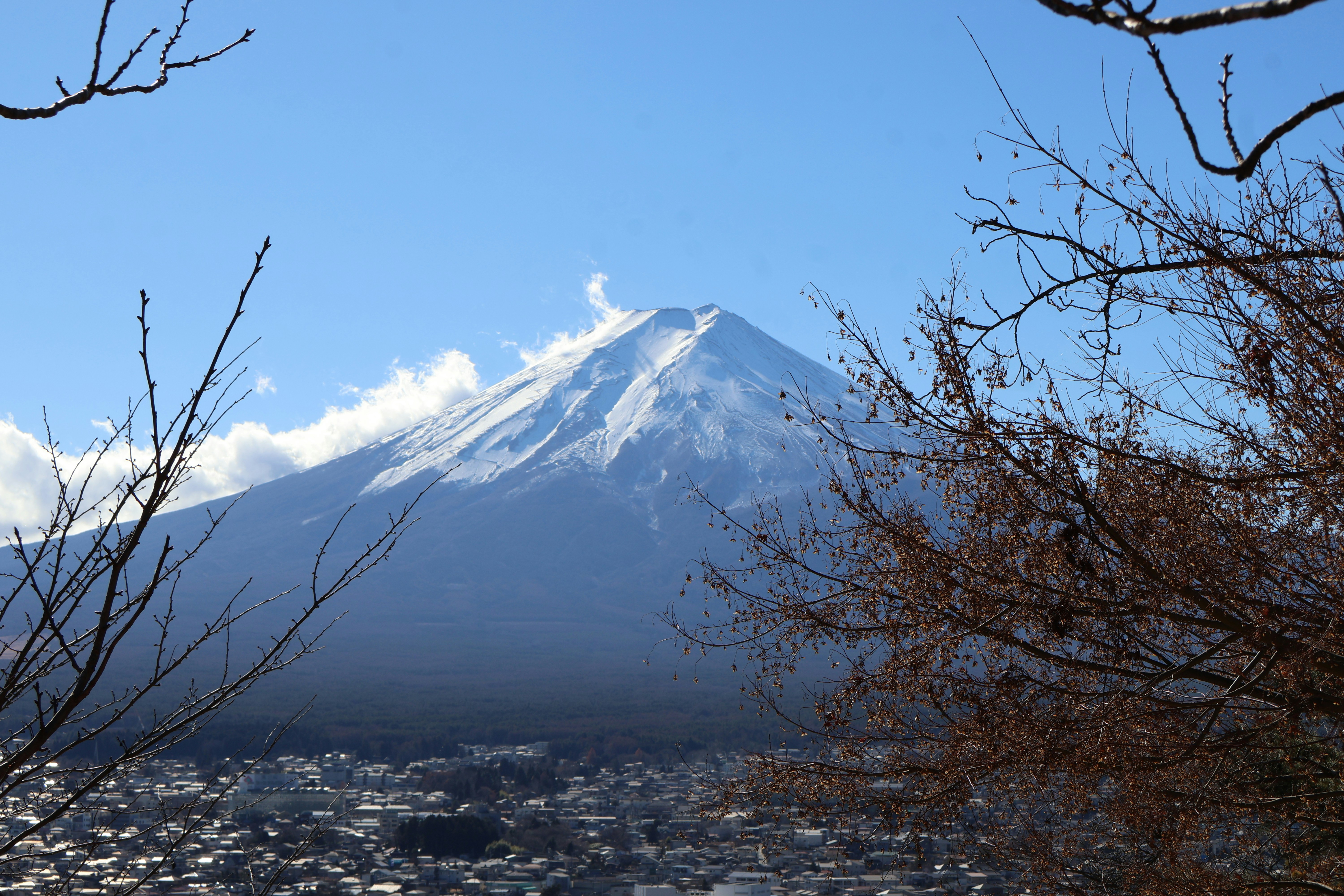 A view of a snow covered mountain in the distance
