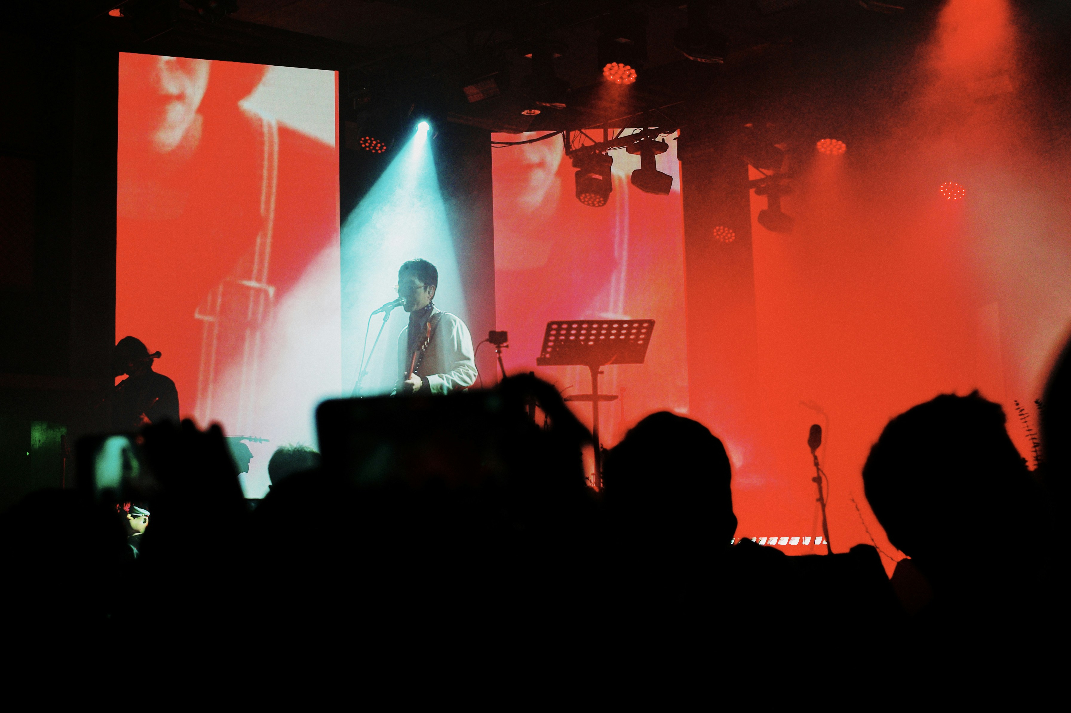 A group of people on a stage with lights