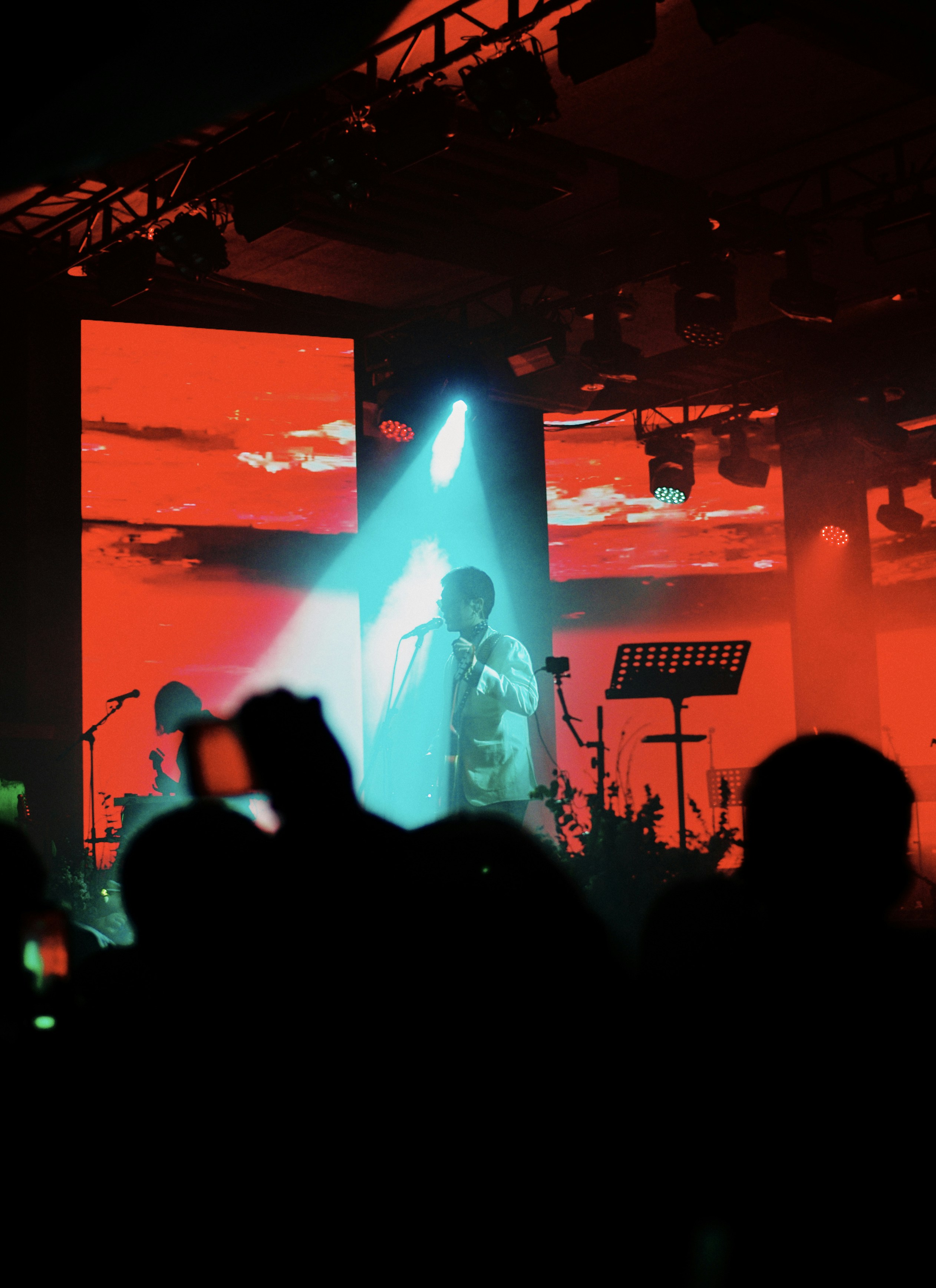 A person on a stage with a microphone