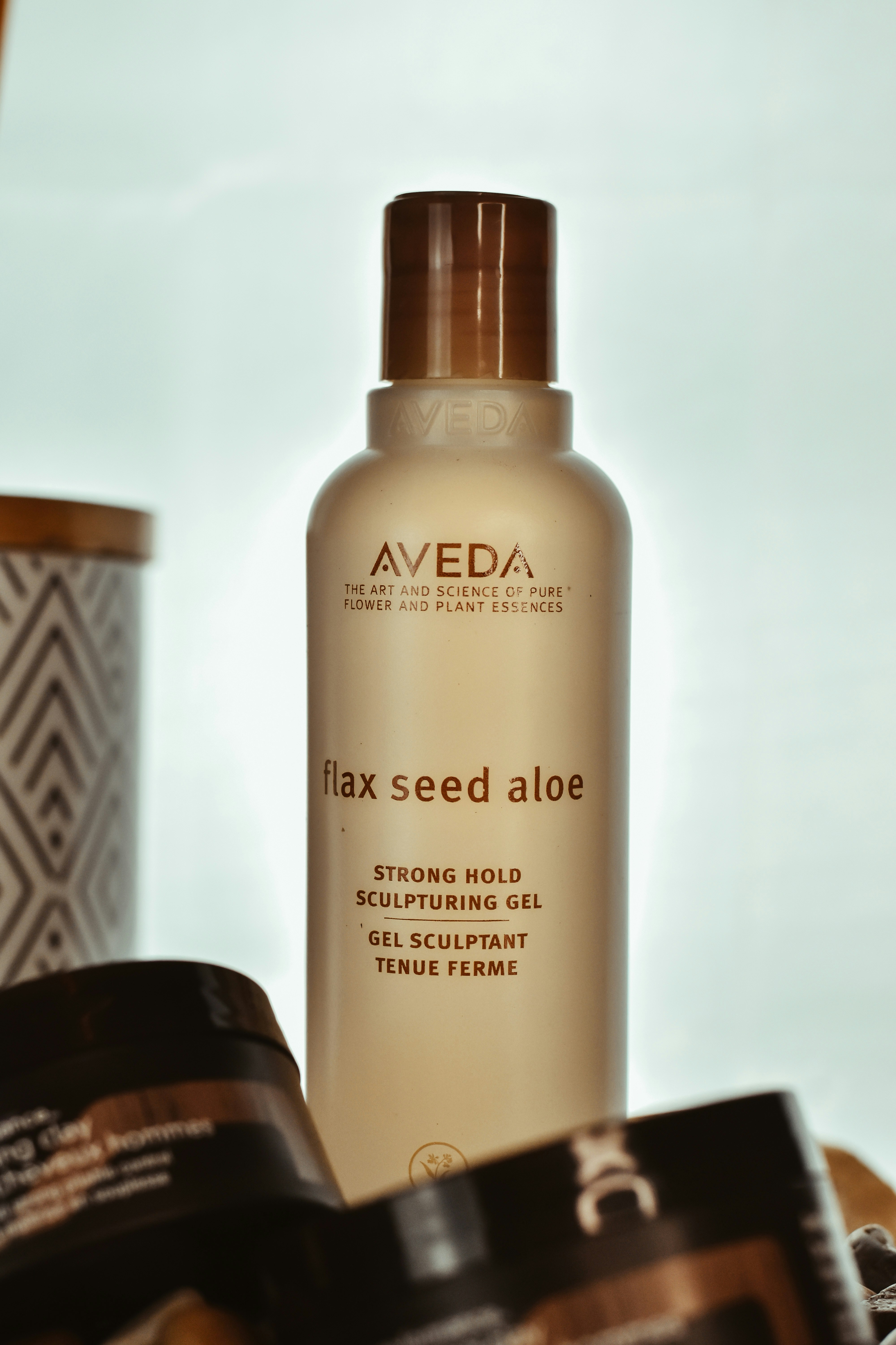 A close up of a bottle of hair products