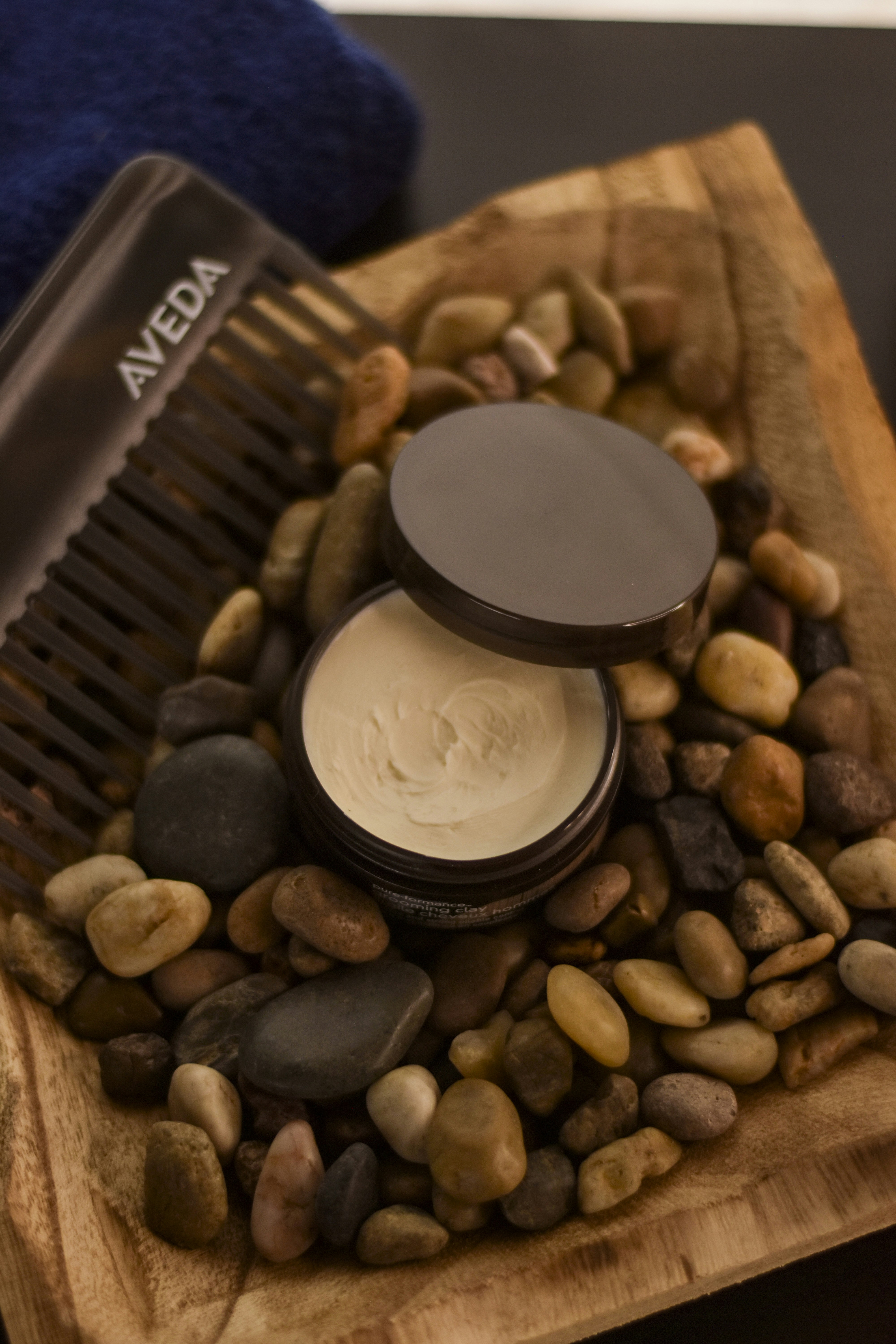 A comb and some rocks on a table