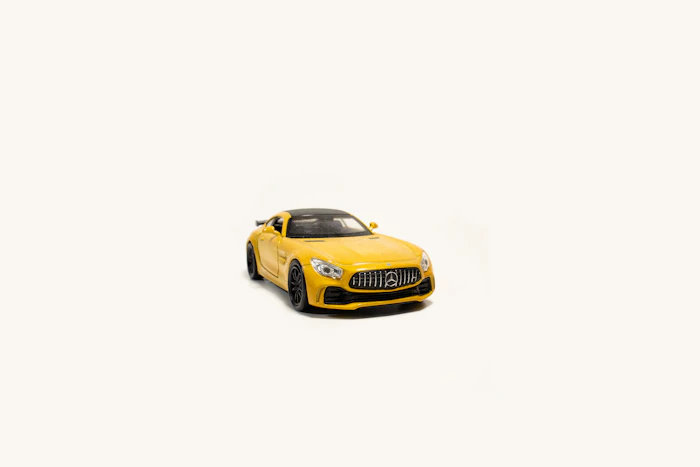 Yellow car on a white background