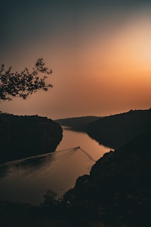 The sun is setting over a body of water