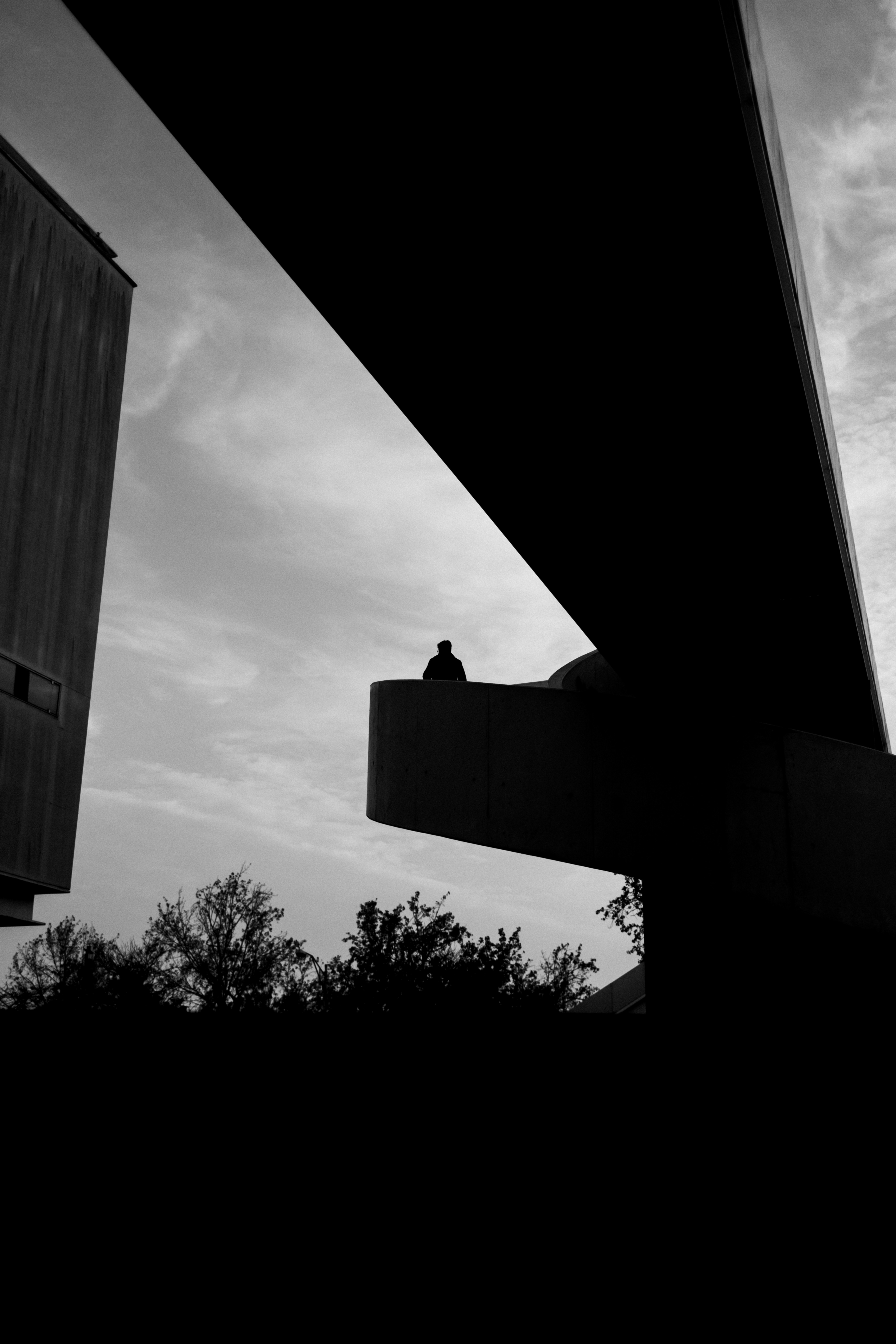 silhouette against a concrete wall