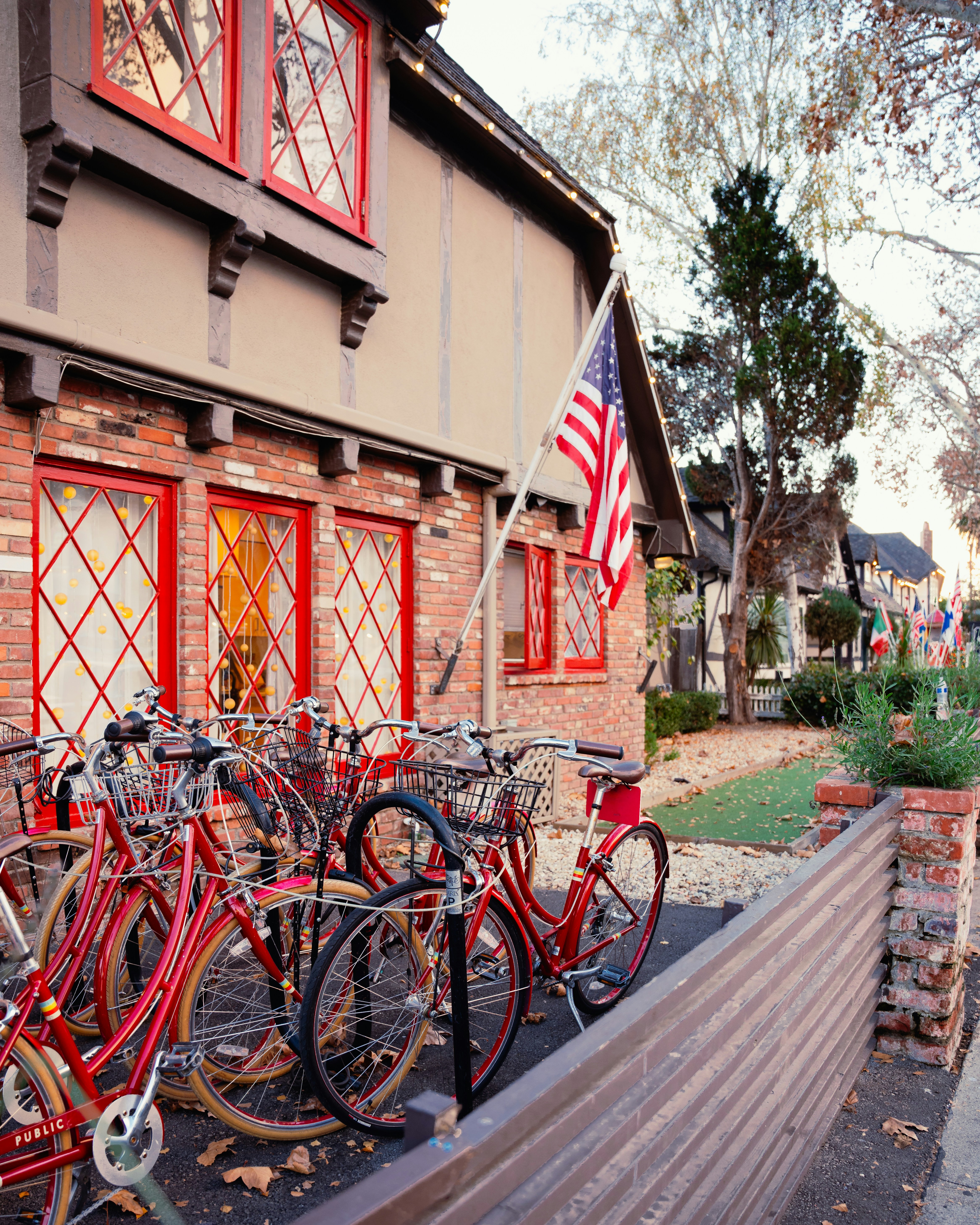A bunch of bikes that are sitting on a fence