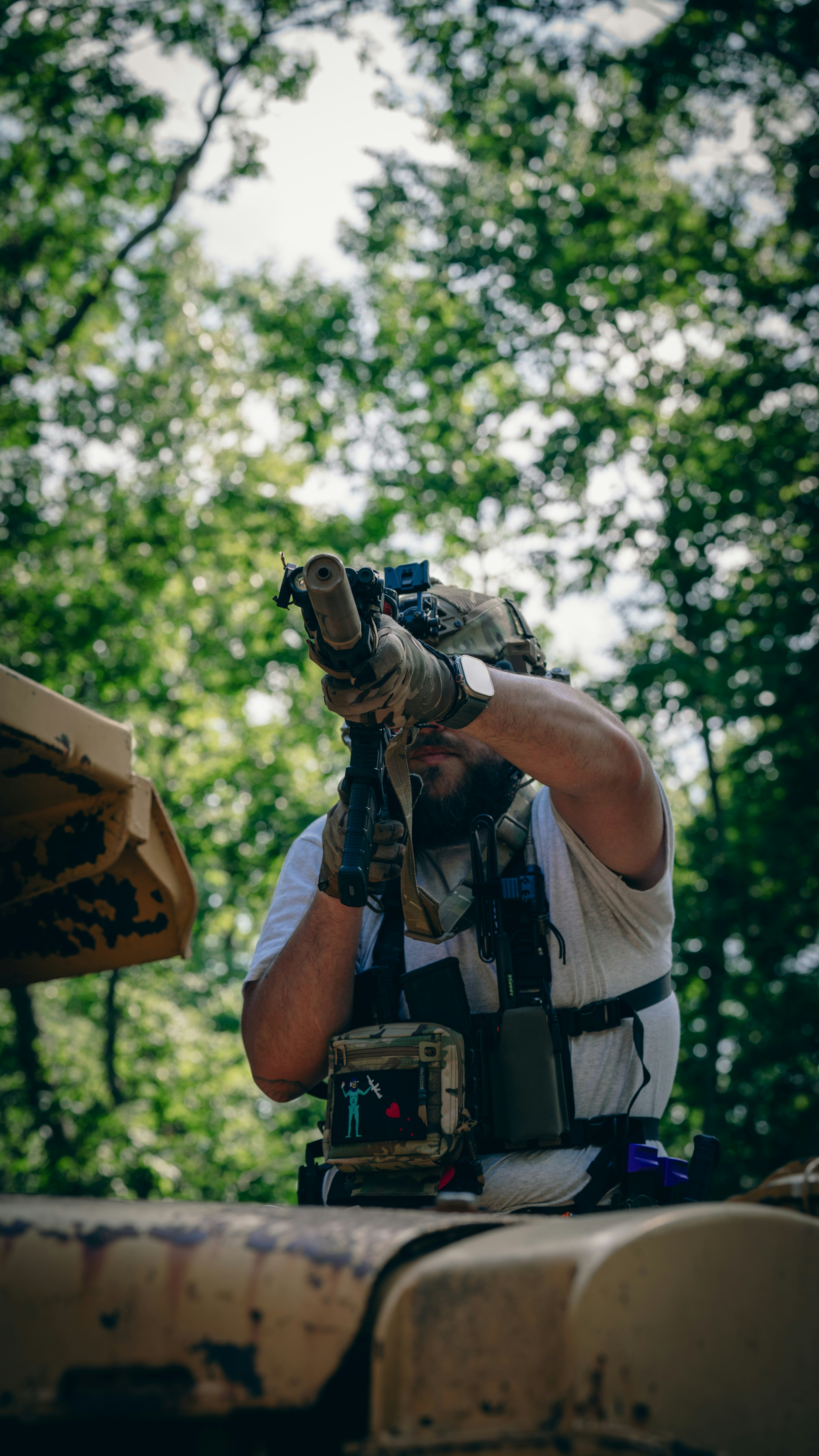 A man holding a camera up to his face