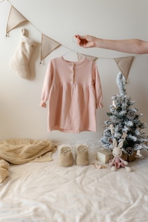 A woman's hand hanging clothes on a clothes line