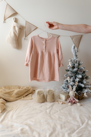 A woman's hand hanging clothes on a clothes line