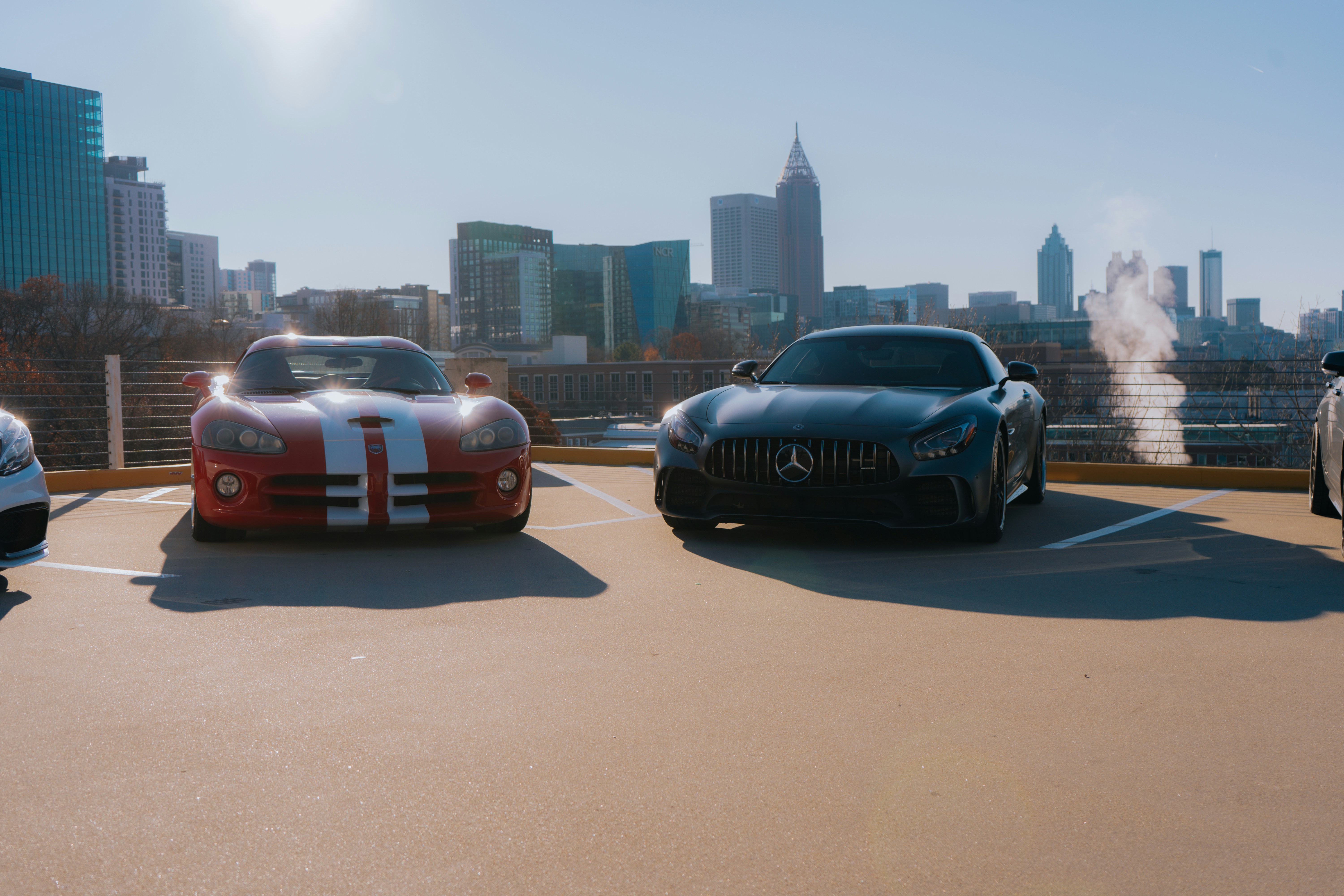 A group of cars parked in a parking lot