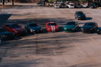A parking lot with several cars parked in it