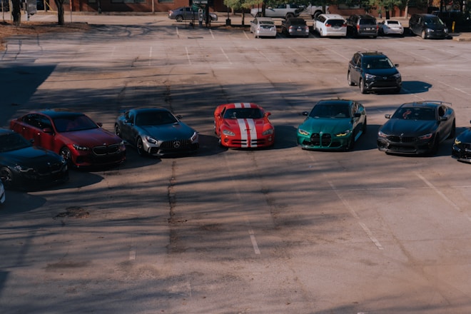 A parking lot with several cars parked in it