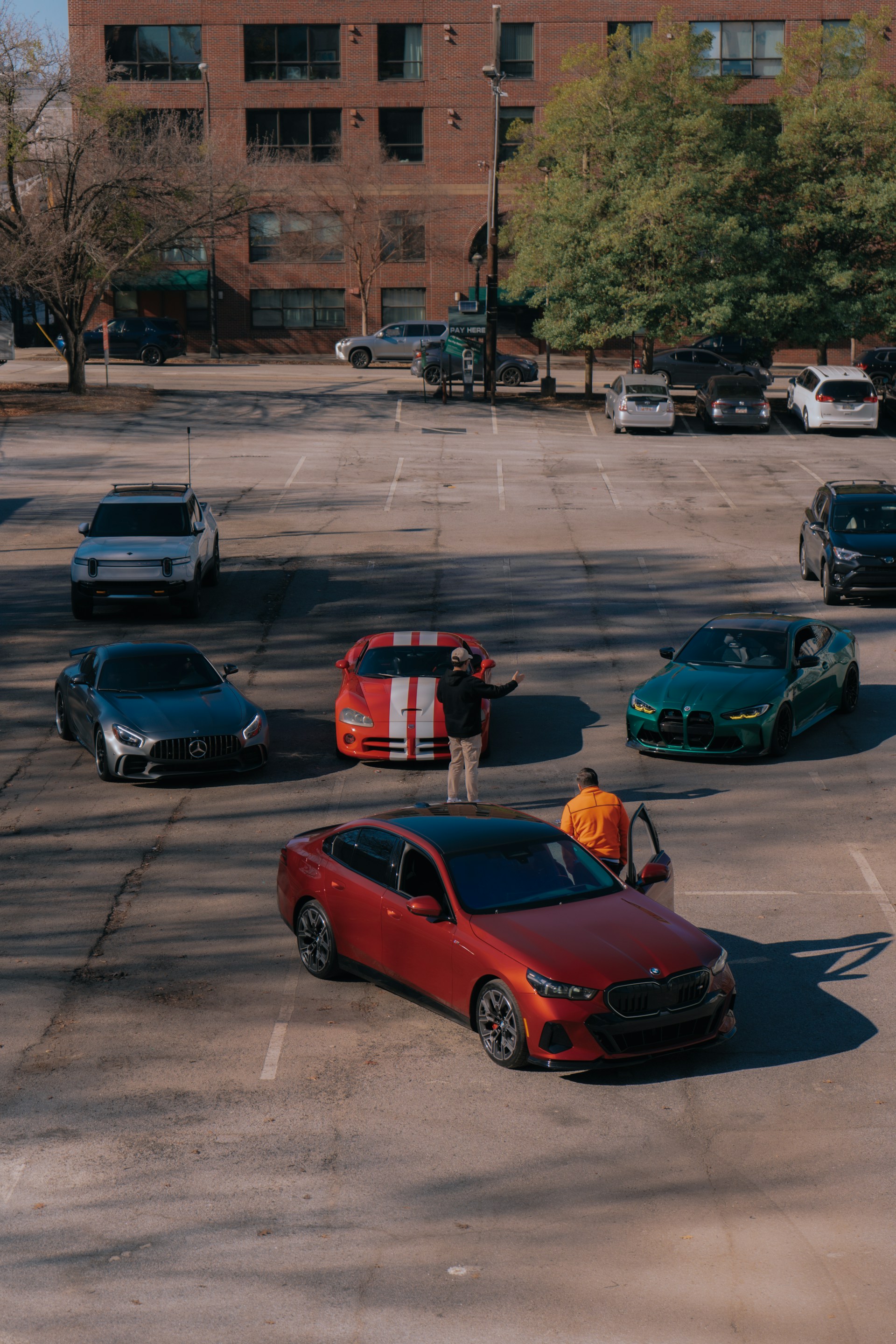A parking lot with several cars parked in it