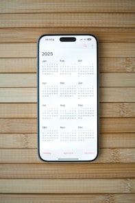 A white calendar on a wooden surface