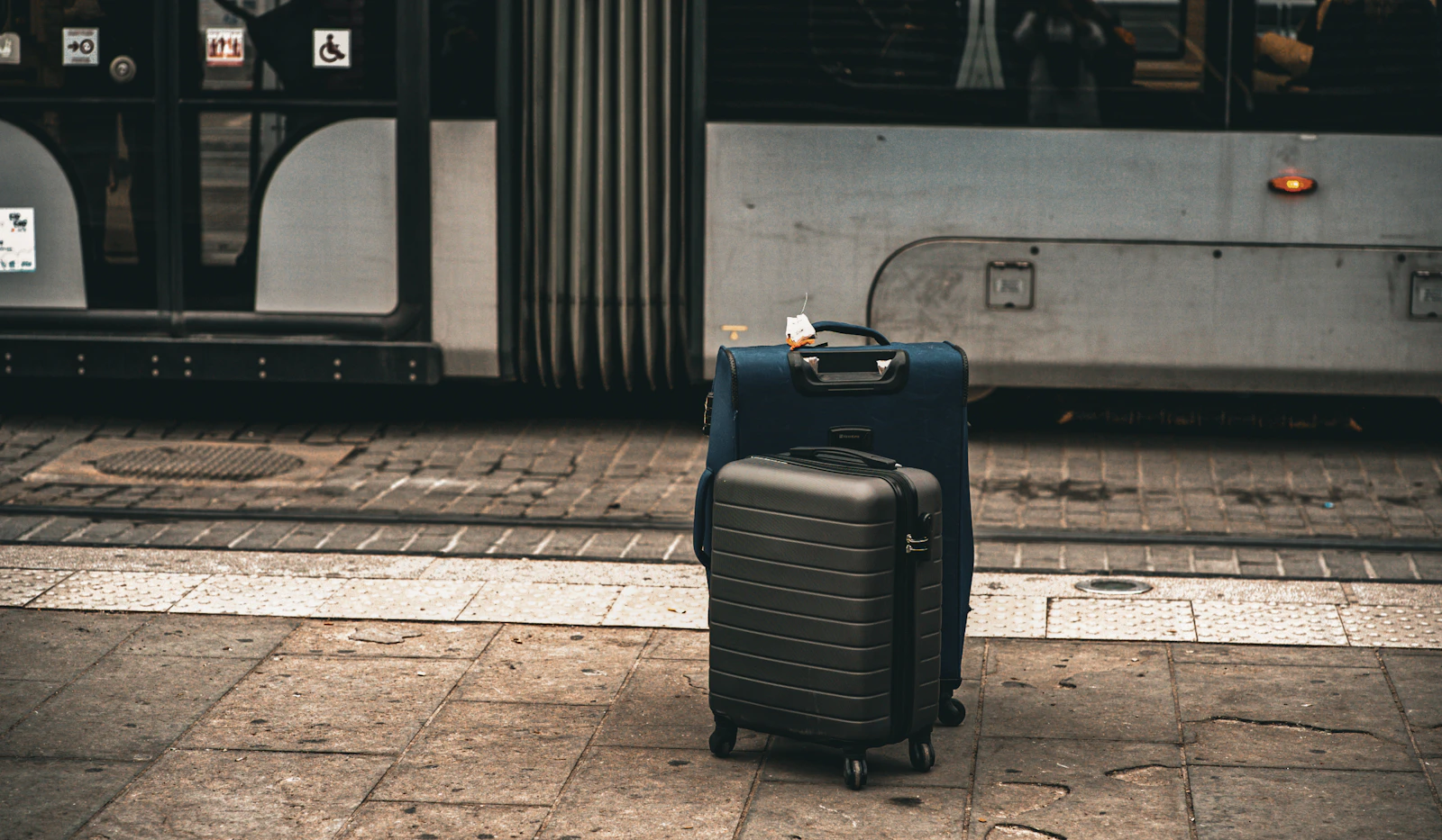 Suitcases waiting at a travel station