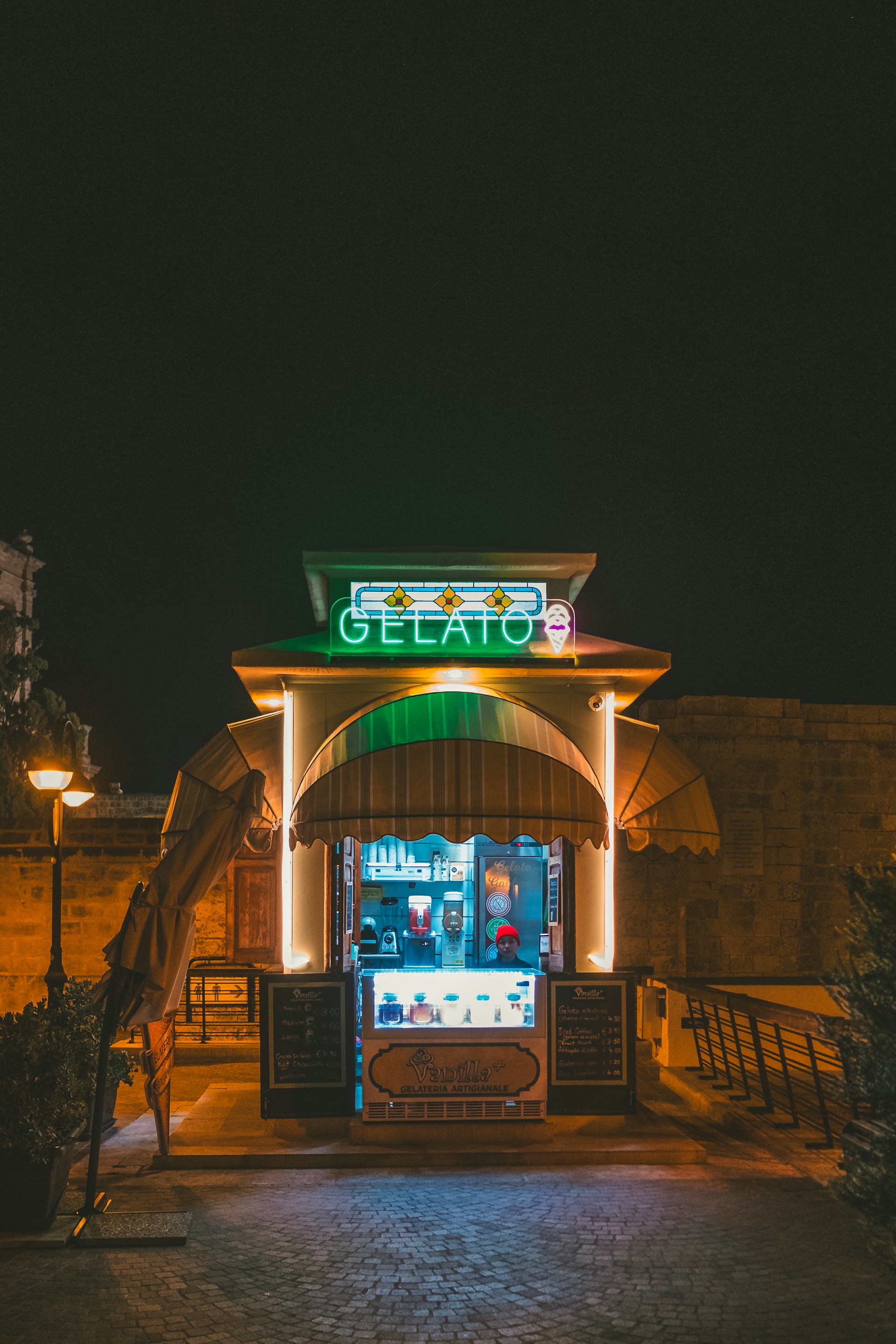 The entrance to a restaurant lit up at night