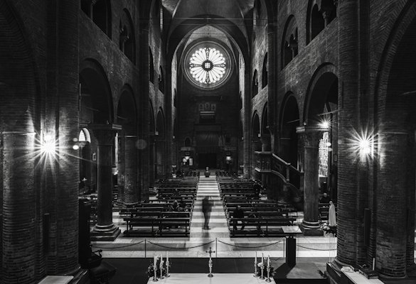 A black and white photo of a church with pews — Modena, Italy