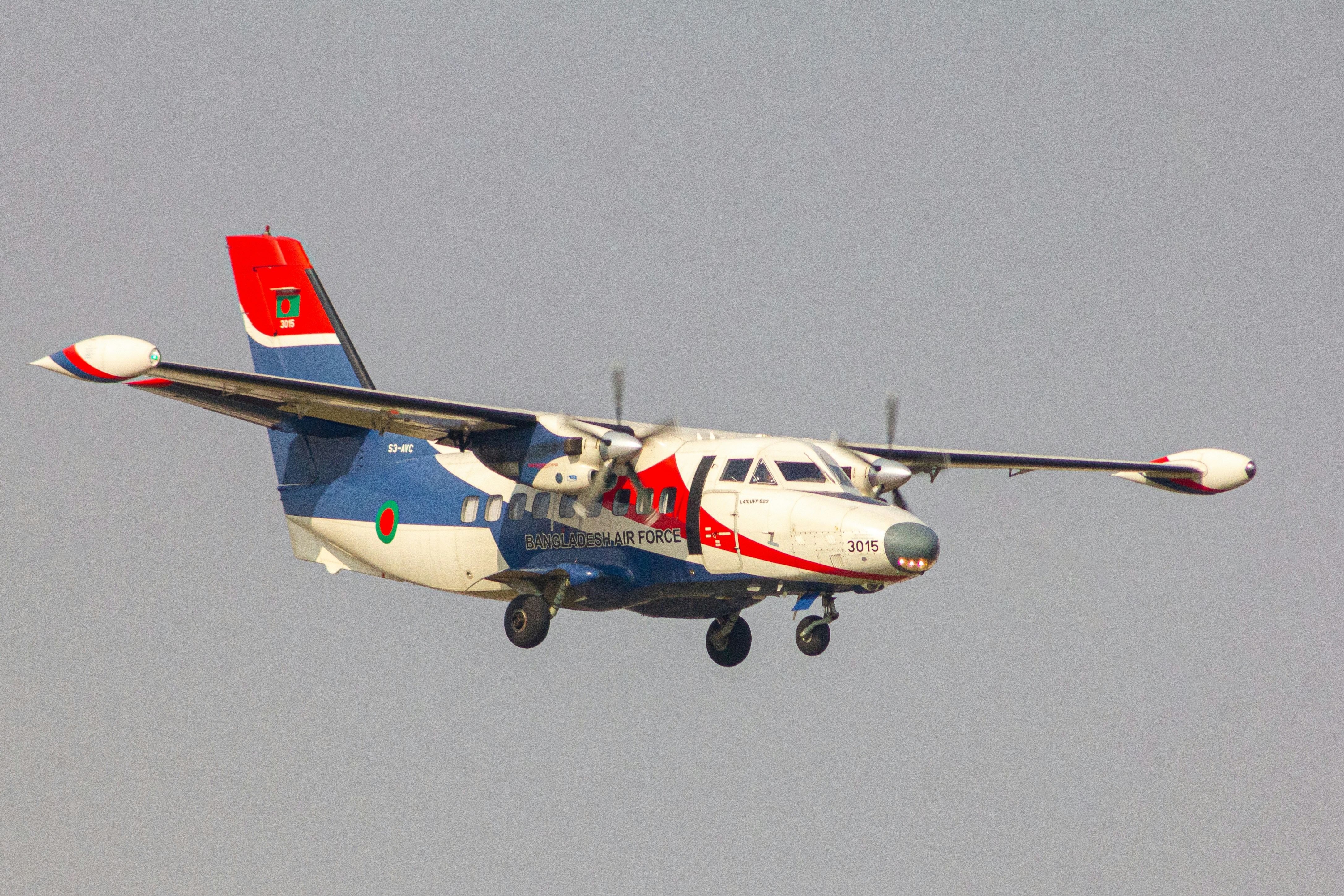 A small propeller plane flying through a gray sky, Bangladesh Air force 🇧🇩 Let Turbolet L-410 S3-AVC