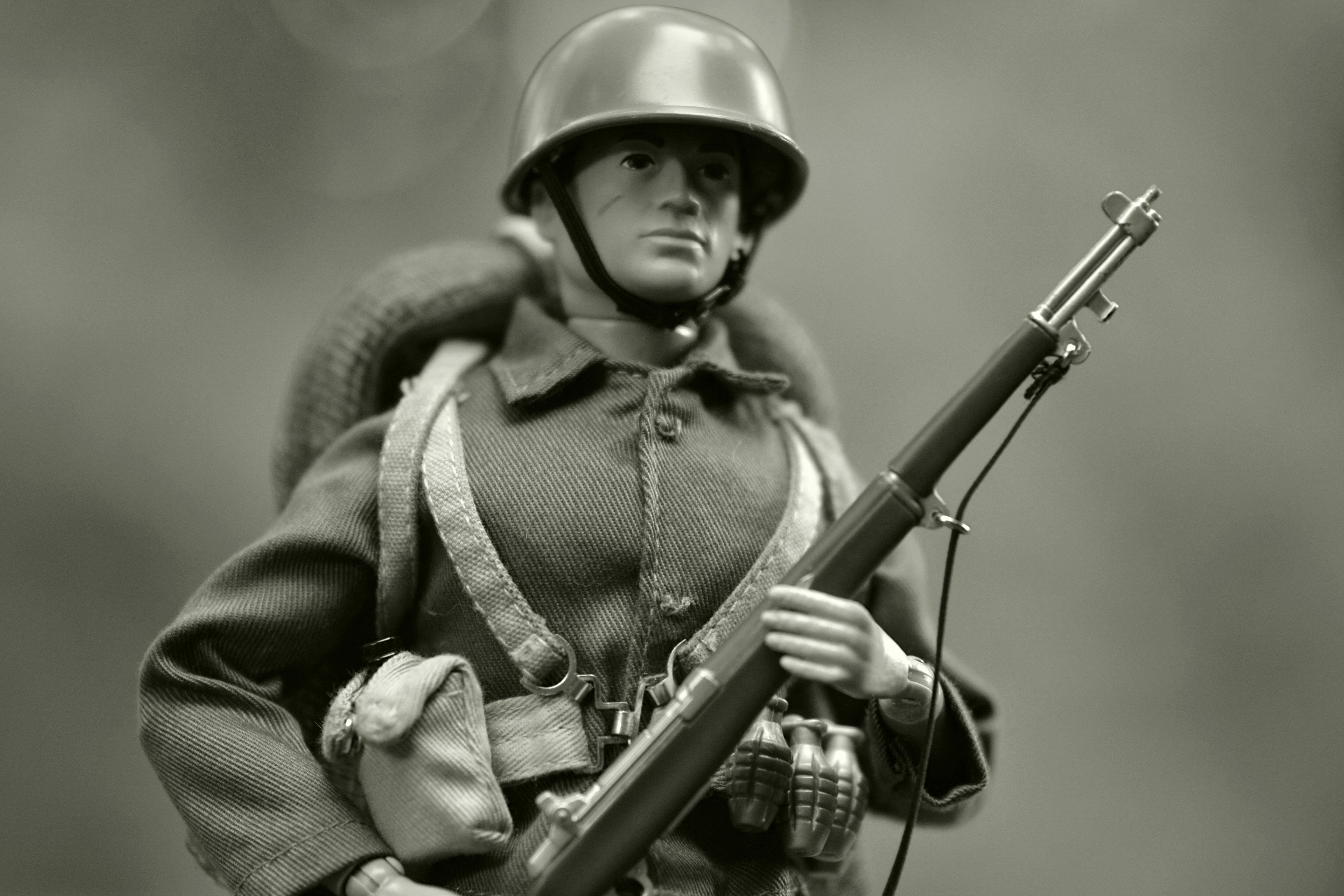 A black and white photo of a toy soldier