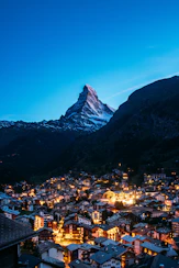 A view of a city with a mountain in the background