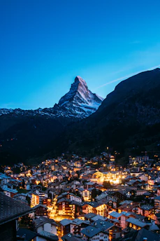 A view of a city with a mountain in the background