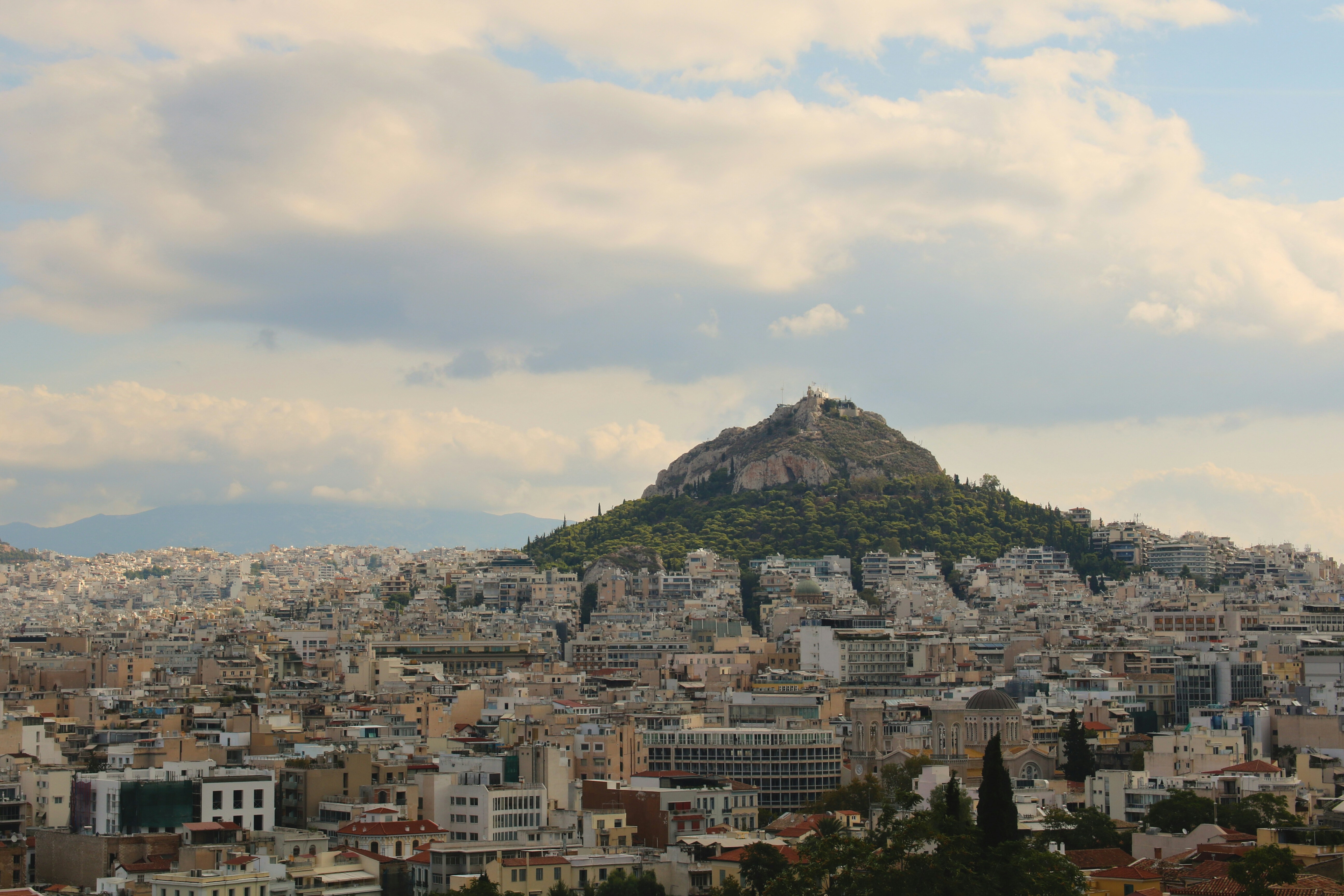 A view of a city with a mountain in the background