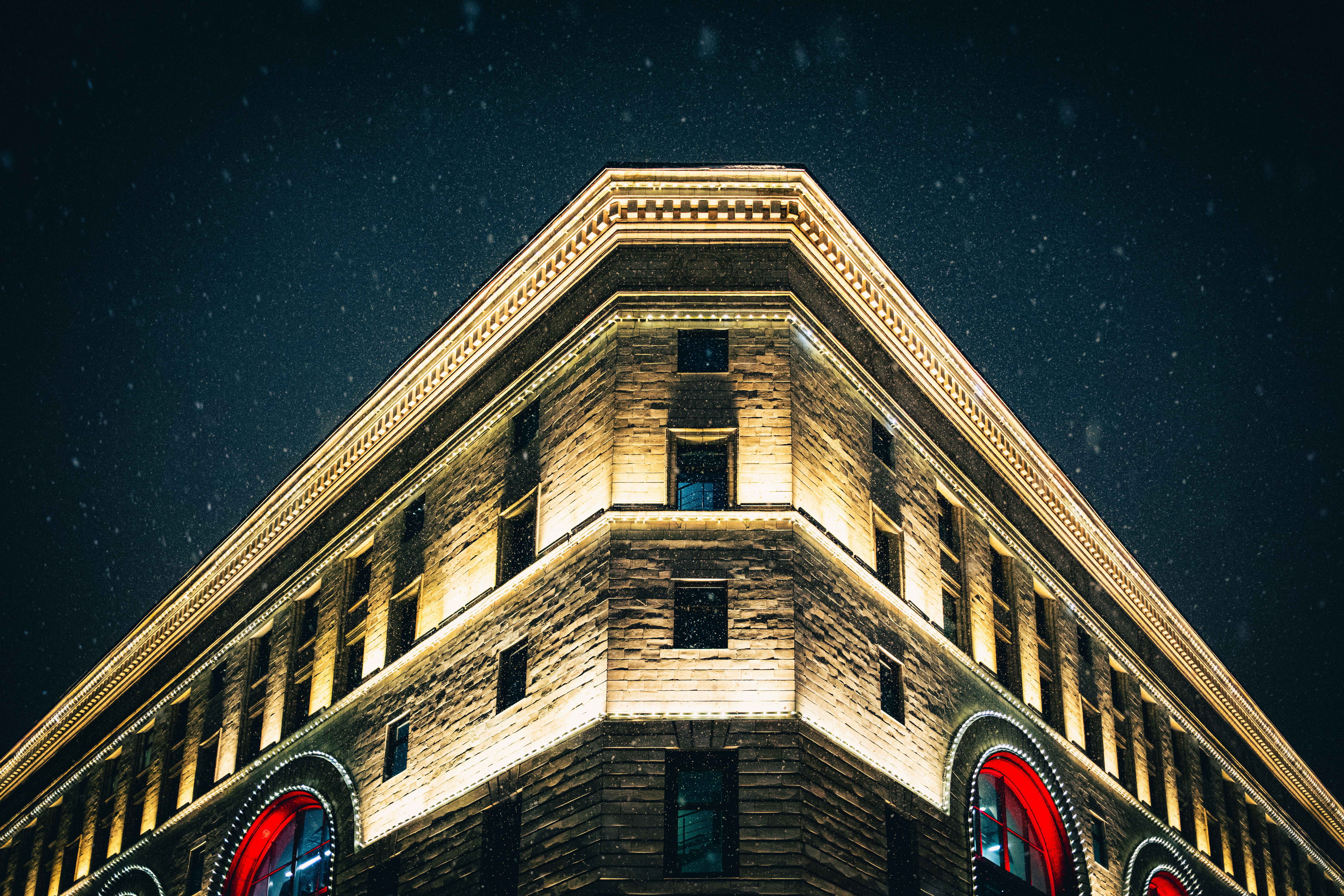 A very tall building lit up at night