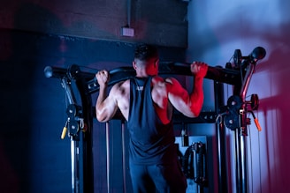 A man doing a pull up on a pull up bar